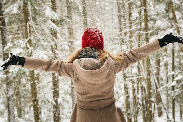 Health Benefits Of Using Body Warmers, woman standing in the snow