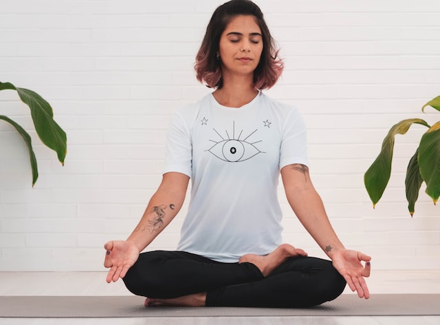 breathing exercise to reduce stress, woman meditating